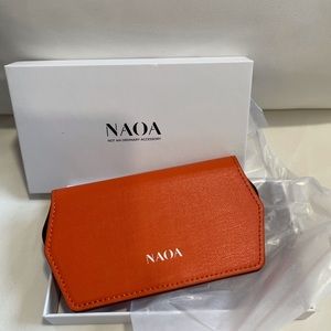 Orange leather slimline glasses case, new in box